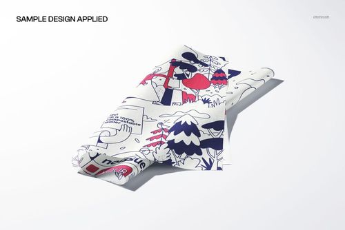 PSD mockup of tissue paper with whimsical designs, natural creases, and gentle lighting on a plain backdrop.