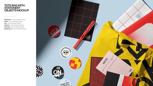 PSD mockup featuring various stationery objects like notebooks, a pen, cards, and a tote bag on a blue background.