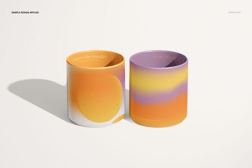 Front view of two handleless mugs with colorful abstract designs, displayed on a light surface in a PSD mockup.