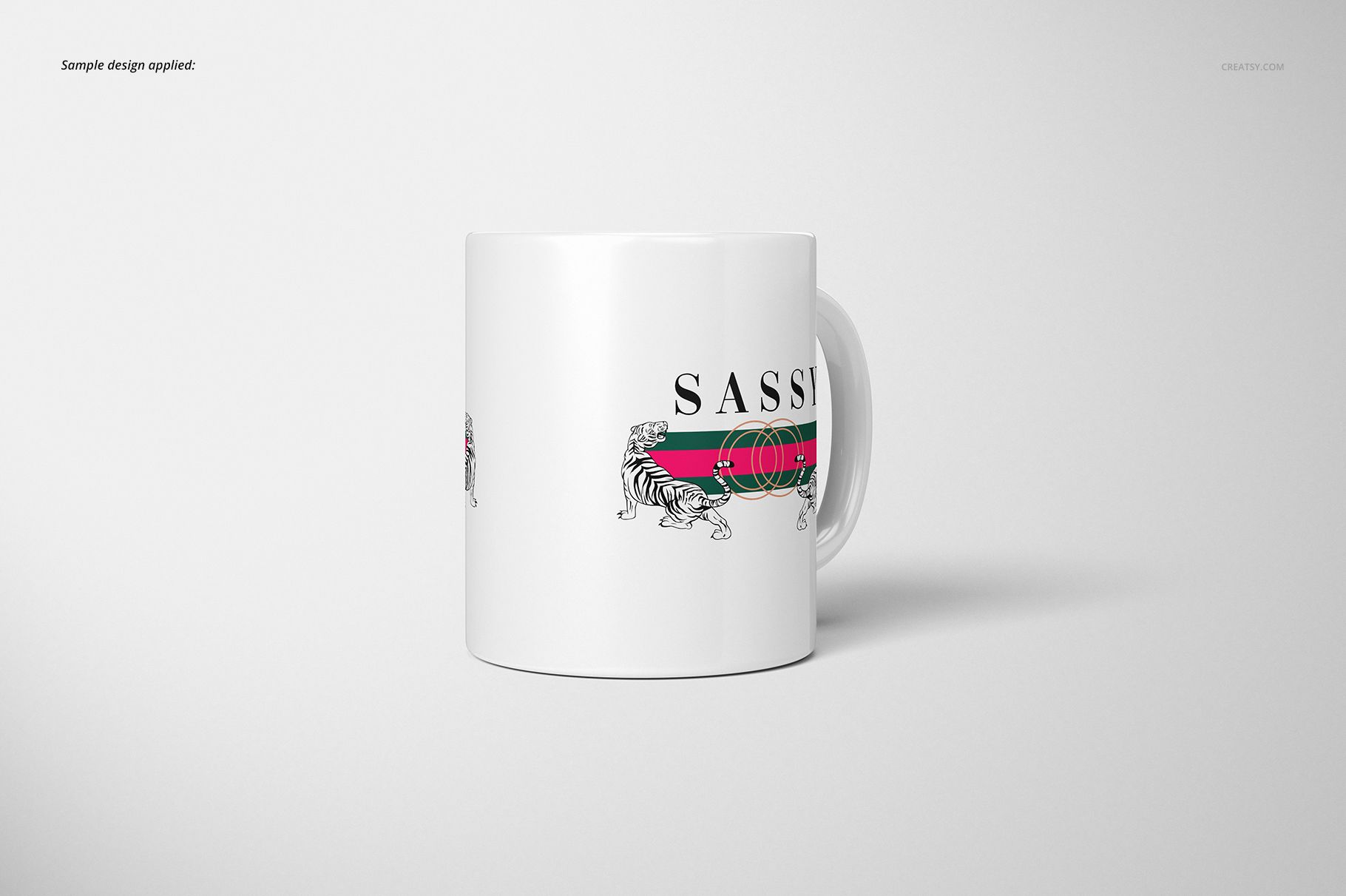 Front view of a white 11oz mug with a horizontal green and red stripe and tiger illustration, set against a plain background.
