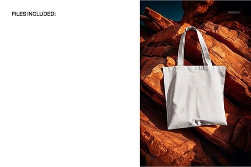 Canvas tote bag mockup with blank white fabric, displayed on rugged orange rocks in natural sunlight, front view.