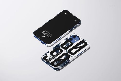 iPhone 12 snap case mockup featuring a glossy finish and striking black and white graphic pattern, viewed from above.