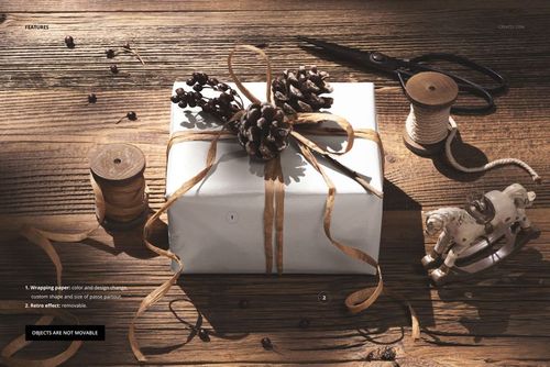 PSD mockup showing a festive gift box with natural decorations, surrounded by spools, scissors, and a wooden horse.