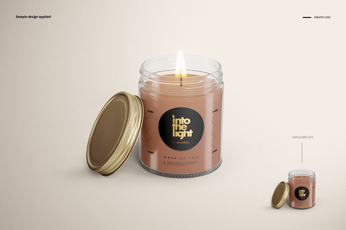 Mockup of a glass jar candle with brown wax, gold screw-top lid, and decorative label, displayed on a neutral surface.