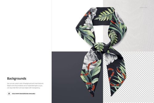 Top view of a tied twilly scarf with a botanical and snake pattern on a dark background, shown on a mockup scene.
