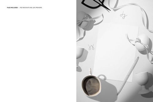 Top view of Easter greeting card mockup with blank card, pen, coffee mug, egg cups, ribbons, and scissors on table.