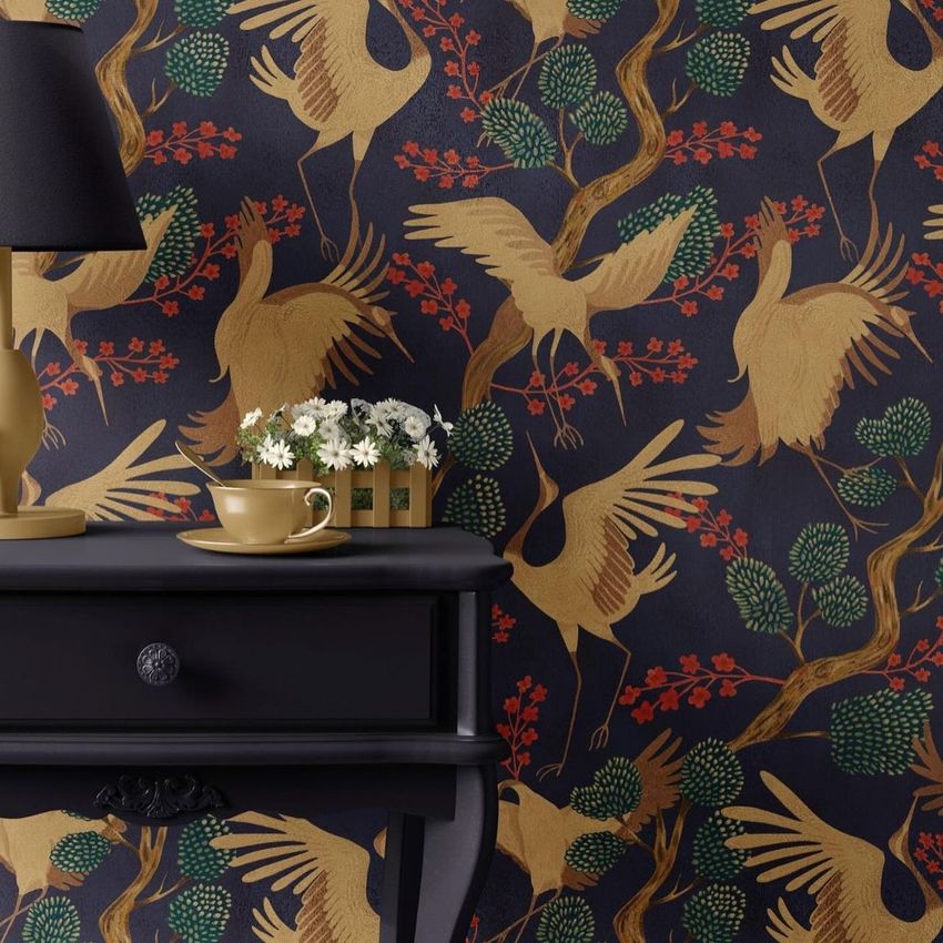 Classic console mockup featuring a dark table with a lamp, cup, and flowers in front of wallpaper with gold cranes and foliage.