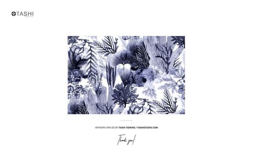 Rectangular mockup image showing a blue and white botanical pattern with leaves and flowers on a velvet cushion design.