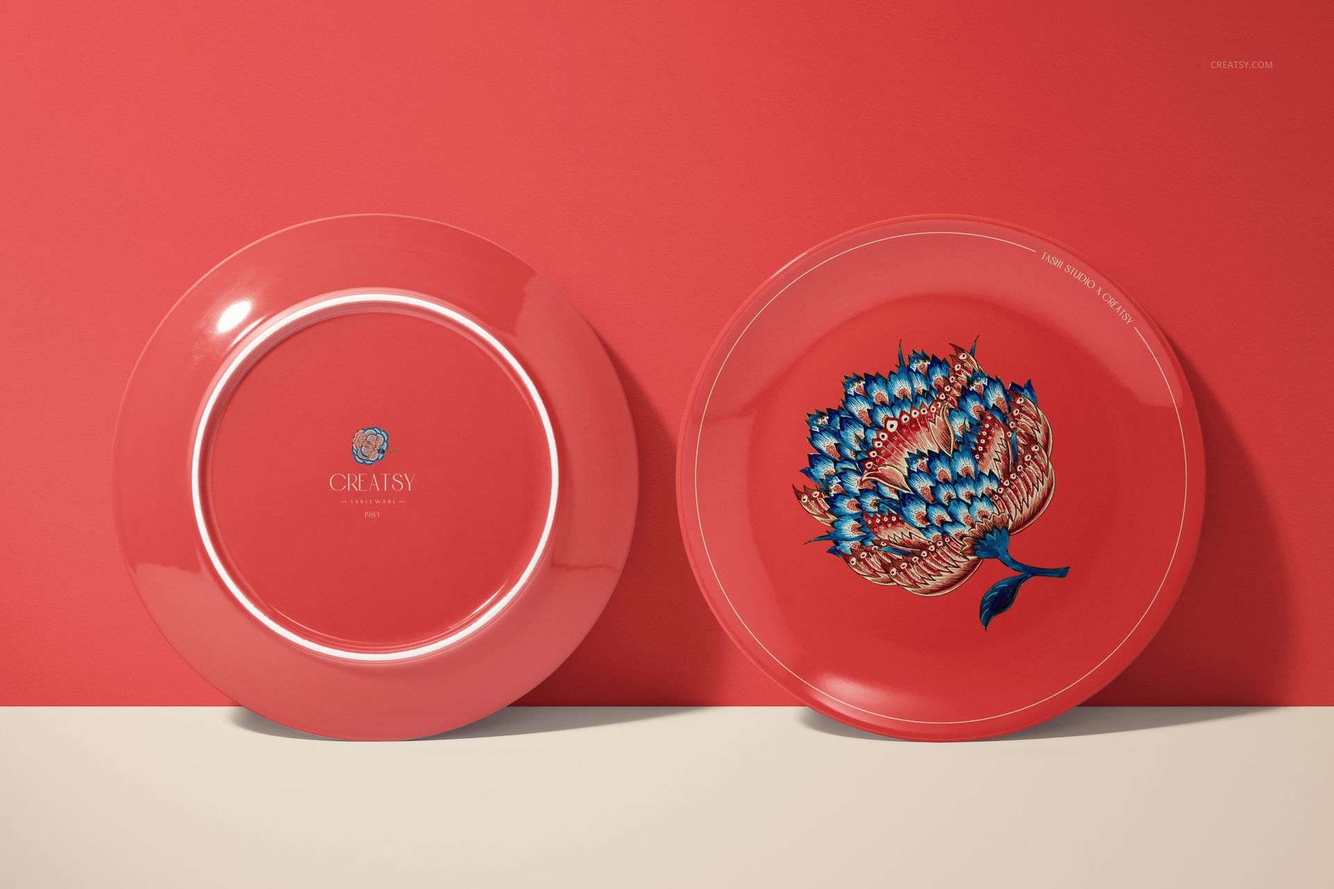 Ceramic plates mockup featuring a front and back view, both in red, with one decorated with a blue floral design.