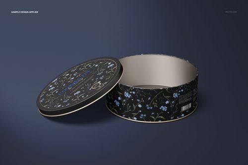 Mockup of a round cookie tin with a black background and blue floral design, shown with the lid ajar.