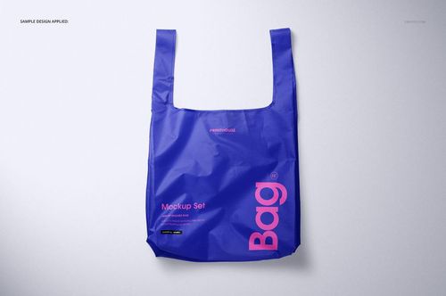 Blue ripstop reusable bag mockup shown from the front, featuring bold pink lettering and a plain backdrop.