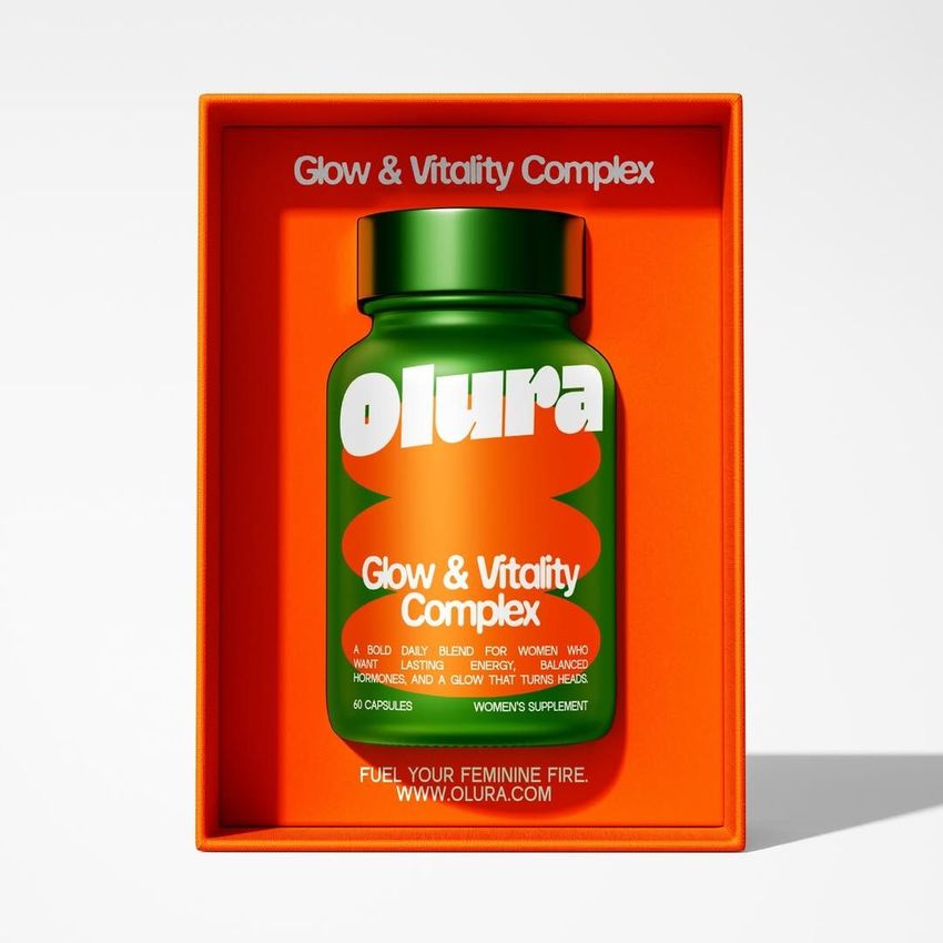 Cosmetics box packaging mockup featuring a green bottle labeled 'Glow & Vitality Complex' inside a bright orange box.