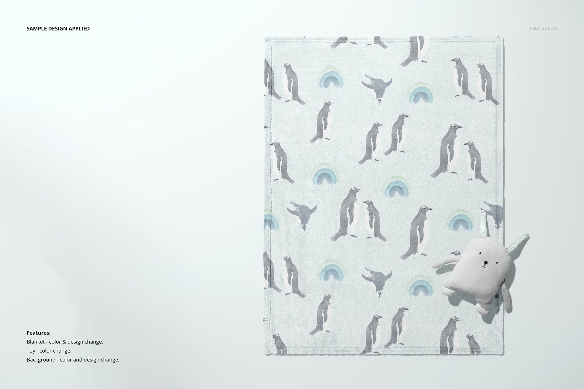 Top view of a 30x40 fleece blanket mockup featuring a repeating dolphin and rainbow print, plus a soft toy nearby.