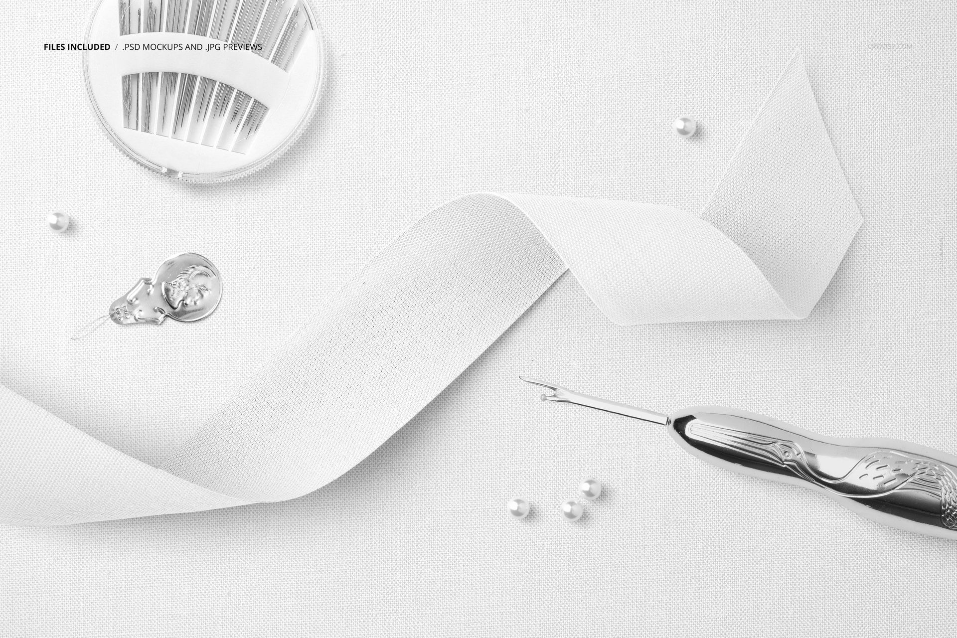 Mockup scene featuring a wide cotton ribbon, sewing needles, seam ripper, and small pearls on a textured background.