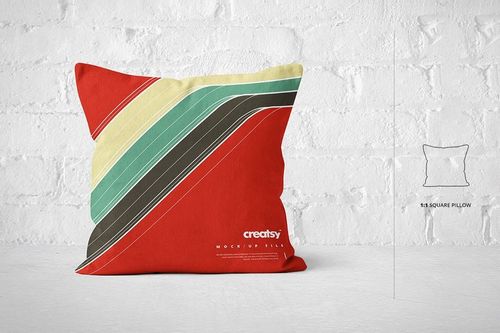 Front view of a square pillow mockup featuring bold diagonal stripes in multiple colors on a bright backdrop.