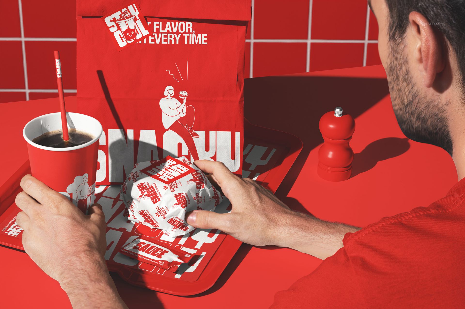 Front view of fast food mockup featuring red paper cup, burger wrapper, takeout bag, and tray on a red tiled table.