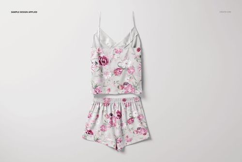 Front view of short silk pajama set mockup featuring a floral pattern in pink and white on a plain background.