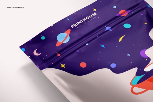 PSD mockup of a stand up zip lock pouch featuring a vibrant cosmic design with planets and stars, close-up view.