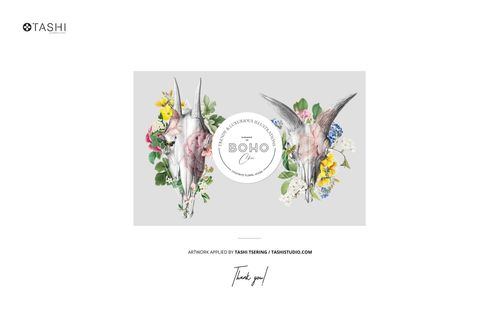 Wall tapestry mockup featuring two animal skull illustrations with floral arrangements on a light gray background, front view.