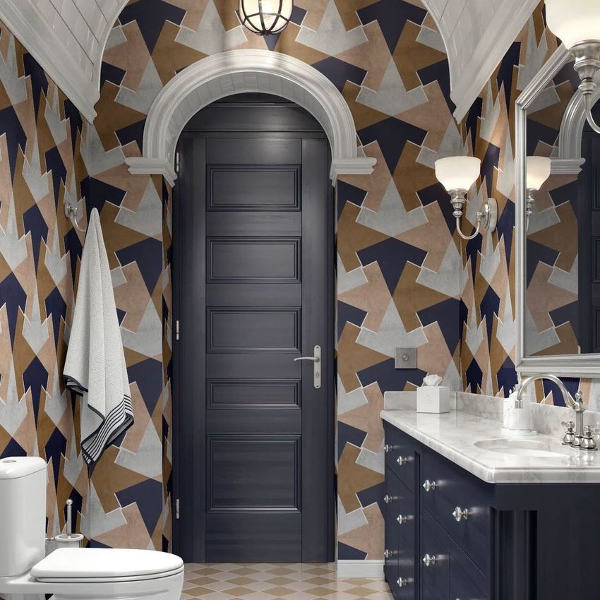 Vintage classic bathroom mockup featuring a dark blue door, geometric patterned wallpaper in earthy tones, and a marble countertop.