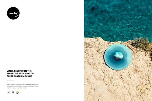 PSD mockup showing a vinyl record on a light-colored rocky shore beside transparent blue sea water, viewed from above.
