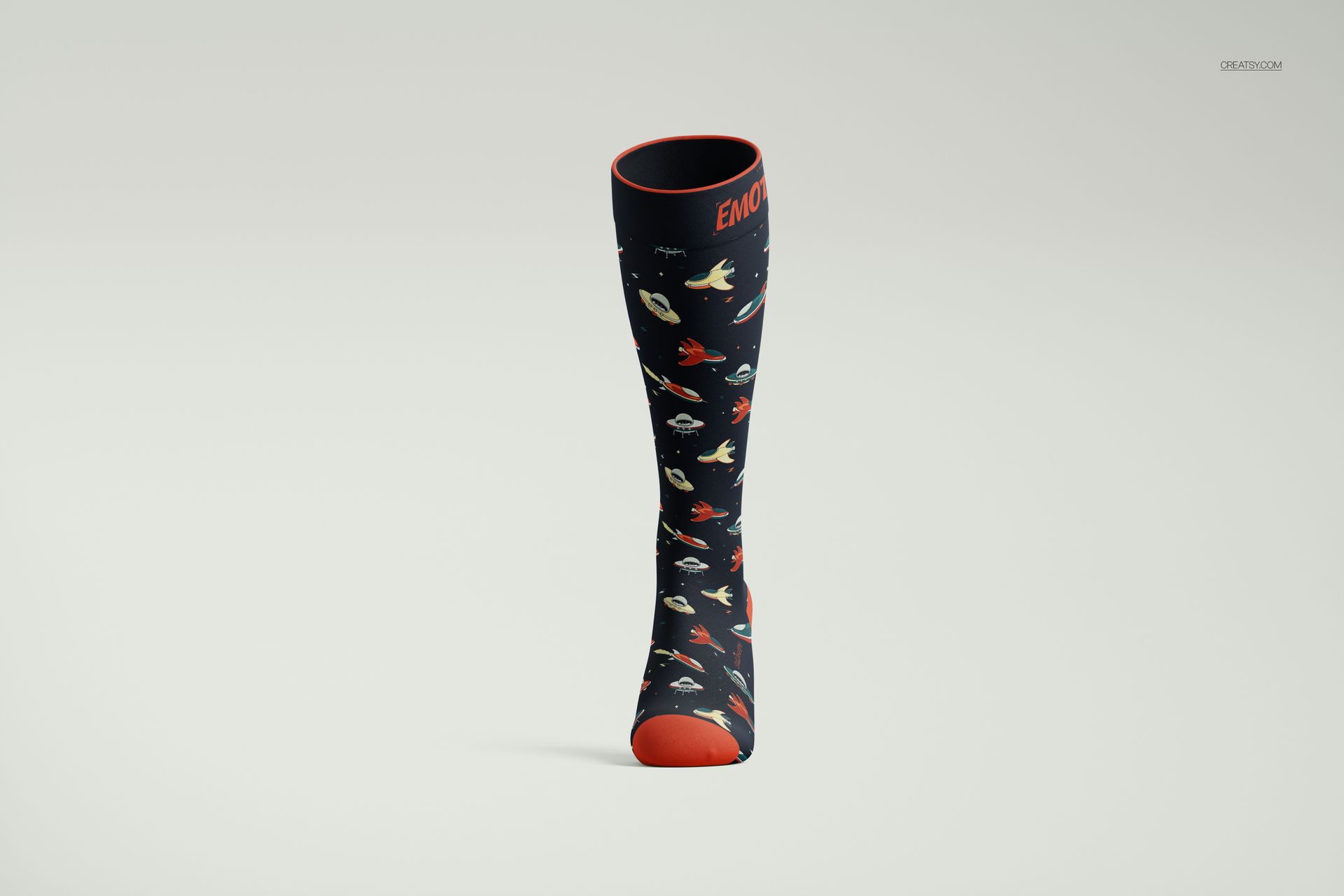 Front view of an over the calf sock mockup with a dark background and colorful space-themed pattern, orange accents.