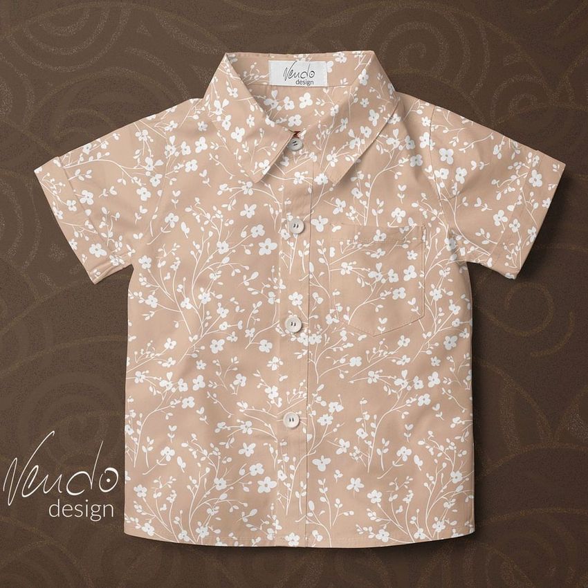 Boys formal set mockup showing a short-sleeve button-up shirt with a beige background and white floral pattern on a brown surface.
