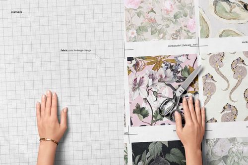 Uncut cotton fabric samples mockup showing a hand on grid fabric and another hand with scissors over patterned swatches.