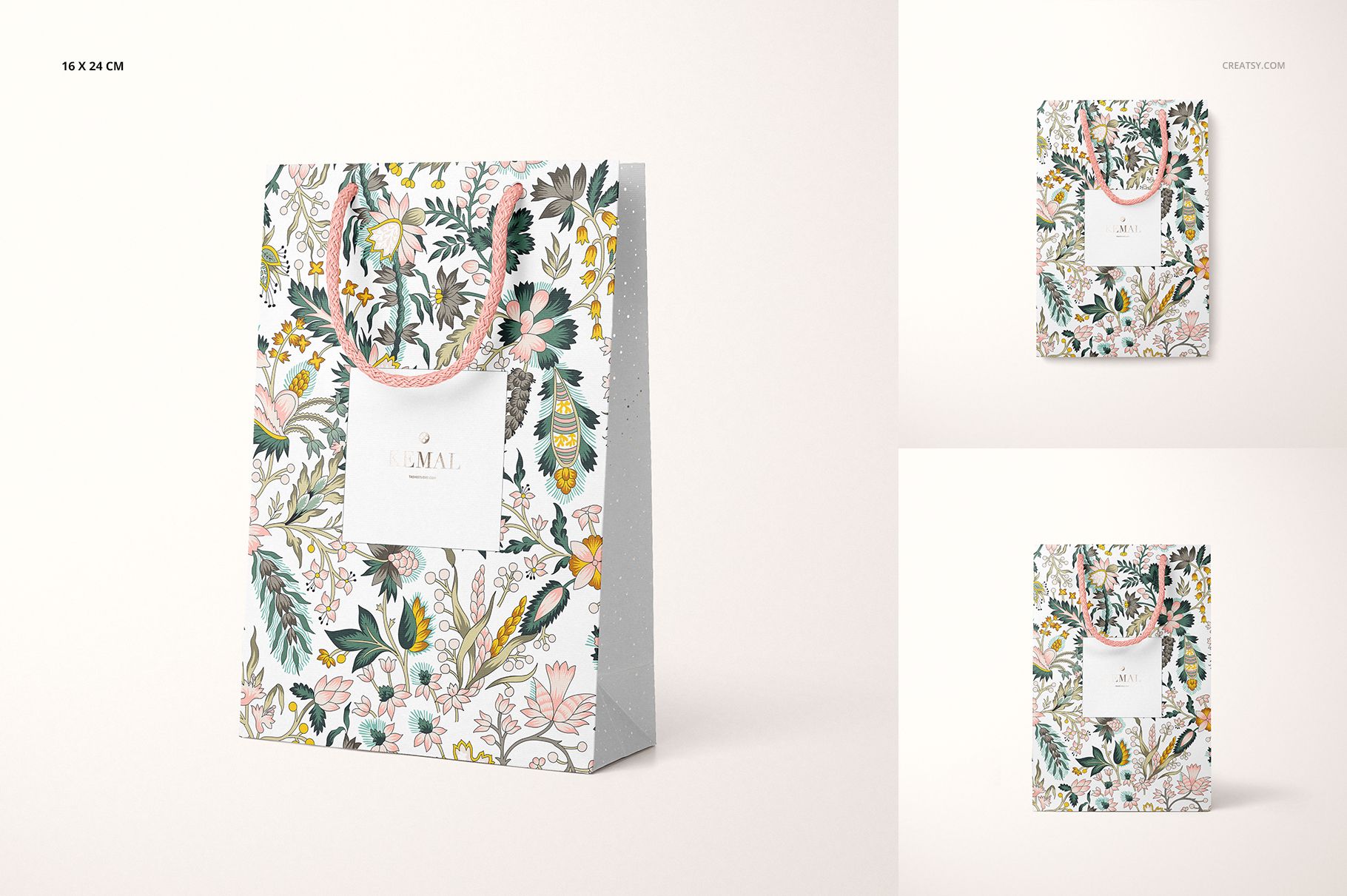 Front view of a paper bag mockup with floral patterns, featuring a white square label and pink handles on a light background.