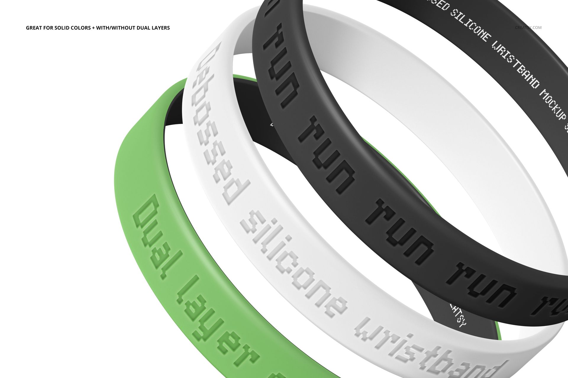 PSD mockup of silicone wristbands featuring debossed lettering, arranged in a layered composition on a white background.