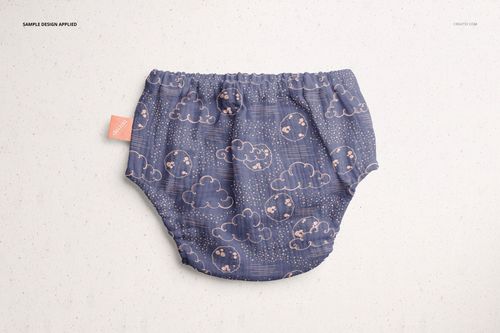 Baby muslin pants mockup featuring a blue fabric with cloud motifs, shown from above on a neutral background.