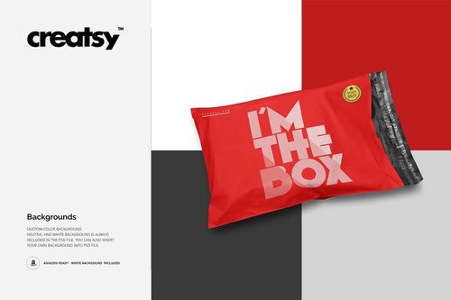 PSD mockup of a rectangular mailing bag in bright red with white lettering, displayed on a multi-colored surface.