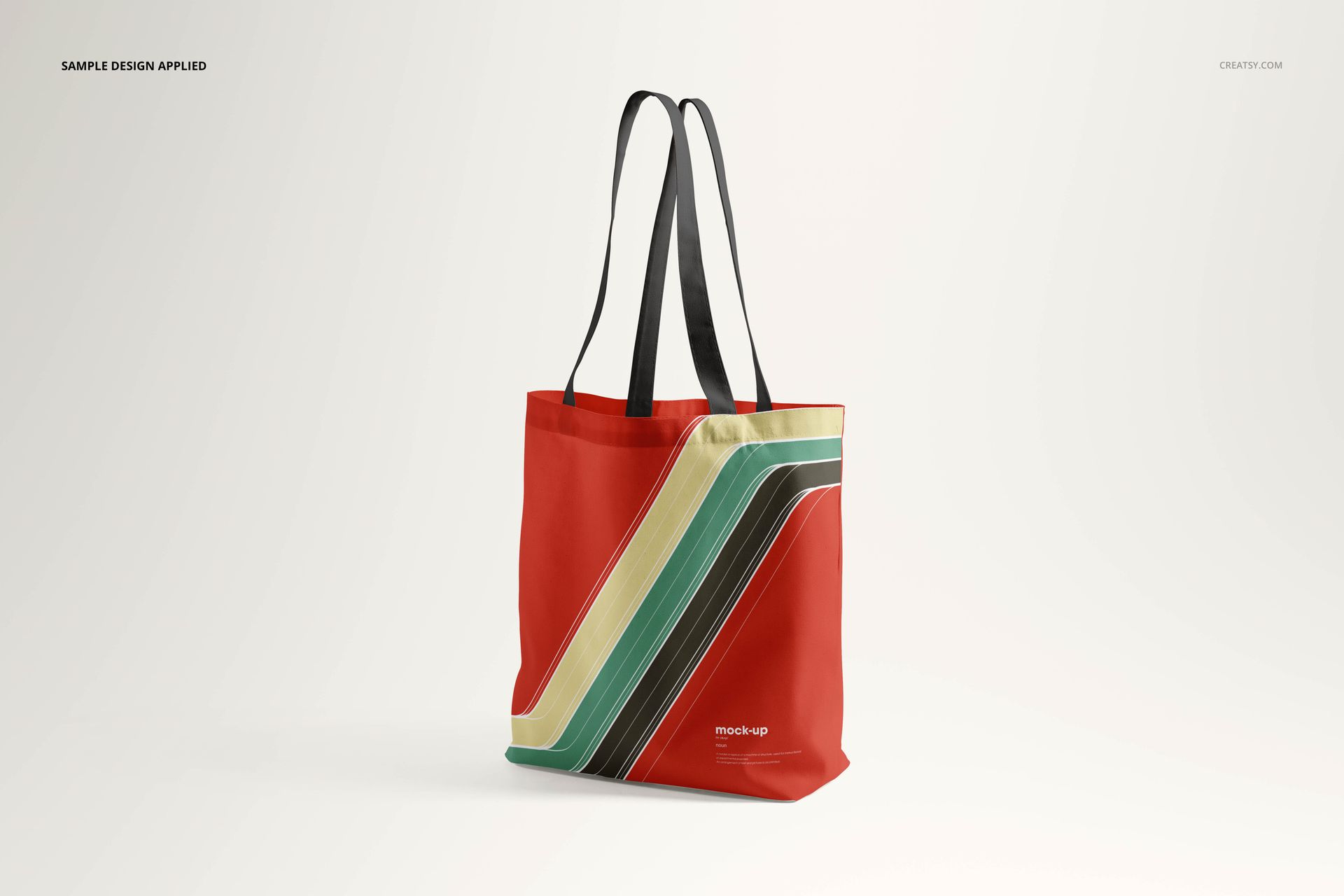Tote bag mockup set displayed upright, showing a colorful diagonal striped pattern on a solid red fabric.