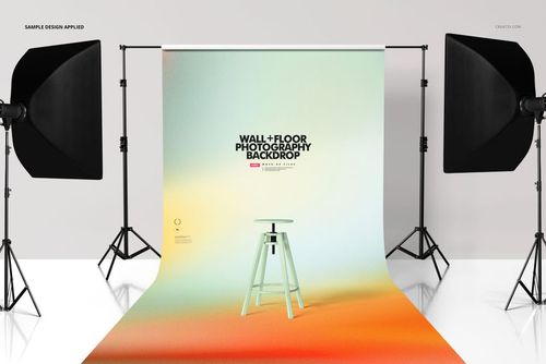 PSD mockup of a roll-up photography backdrop in a studio, with gradient hues and a simple stool centered on the backdrop.