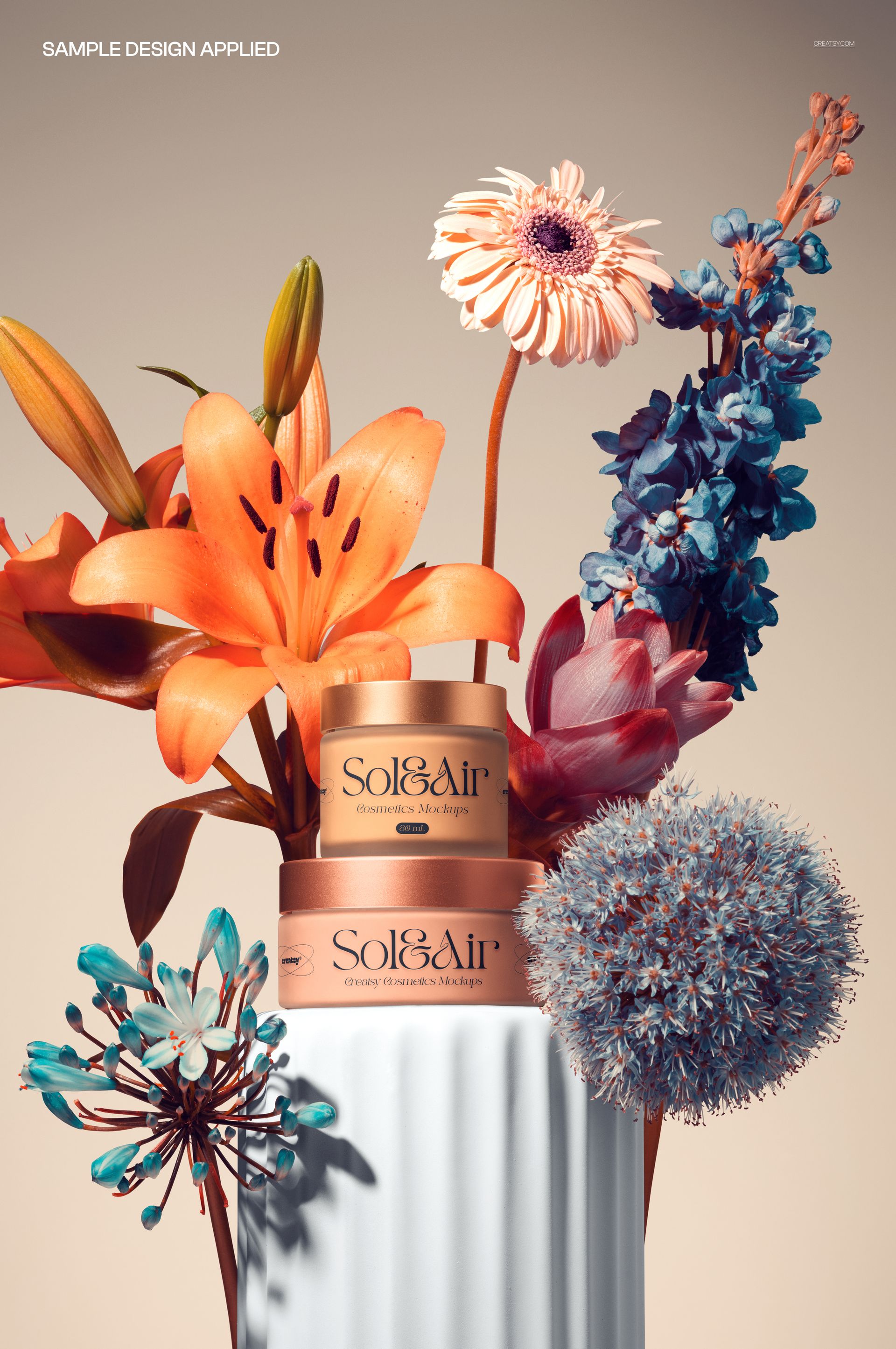PSD mockup featuring two gold cosmetic jars placed on a ribbed white pedestal, with assorted colorful flowers around.