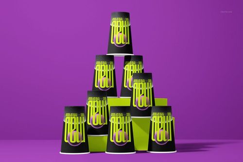 PSD mockup featuring a group of paper cups with black and neon green colors, stacked in a pyramid on a vibrant purple surface.