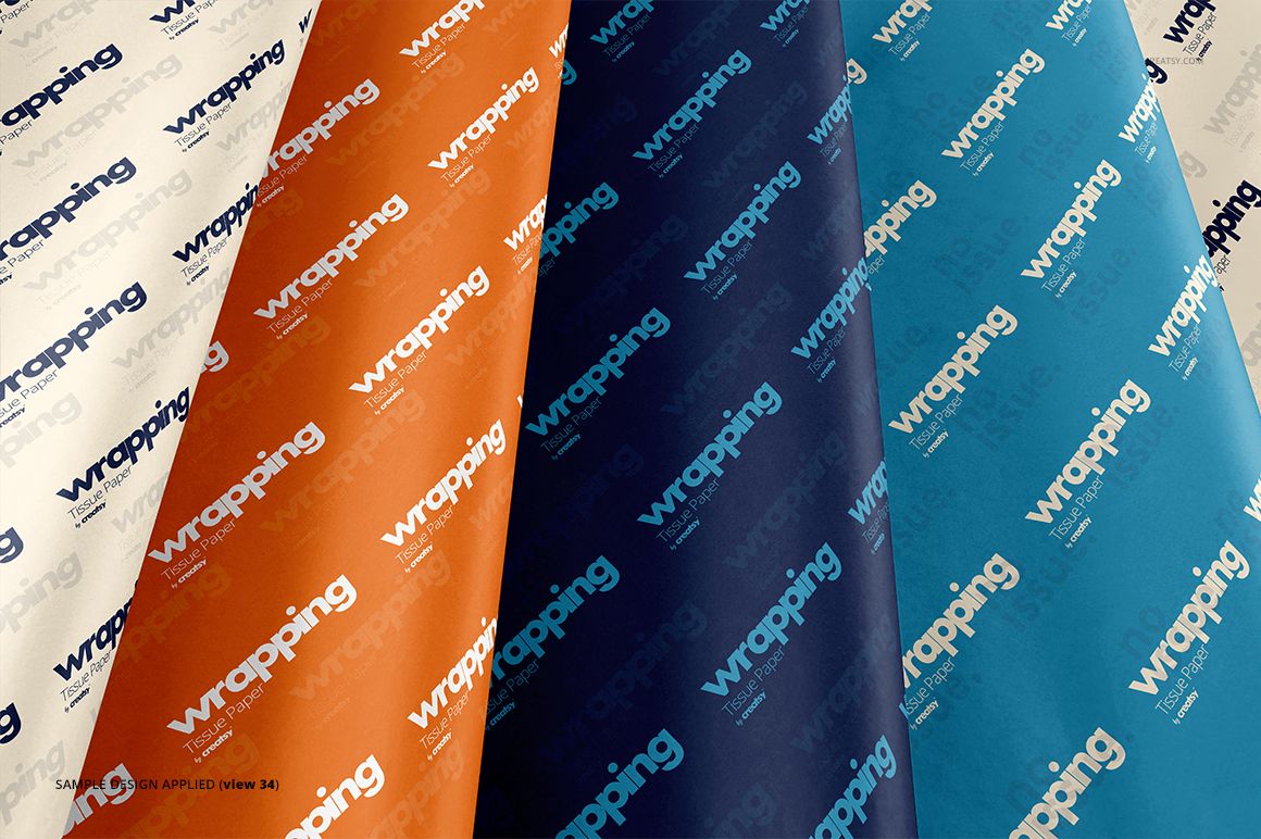 Front view of wrapping tissue paper mockup bundle featuring four colored sheets with diagonal text patterns.