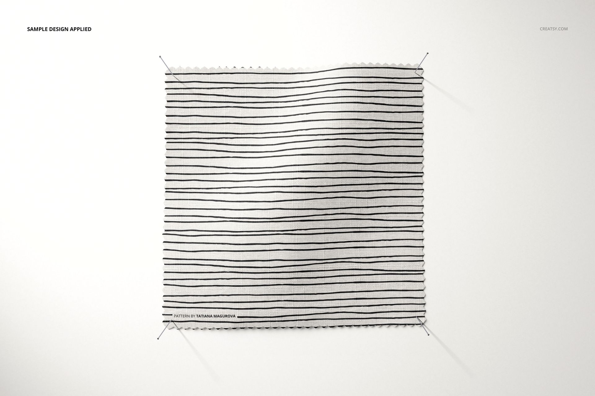 Square fabric swatch mockup pinned at four corners, featuring thin black horizontal stripes on a white background.
