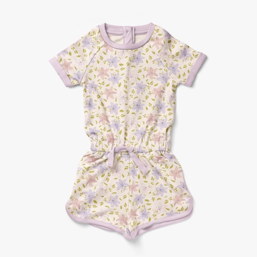 Girls cotton playsuit mockup featuring a short-sleeve romper with a pastel floral pattern on a white background.
