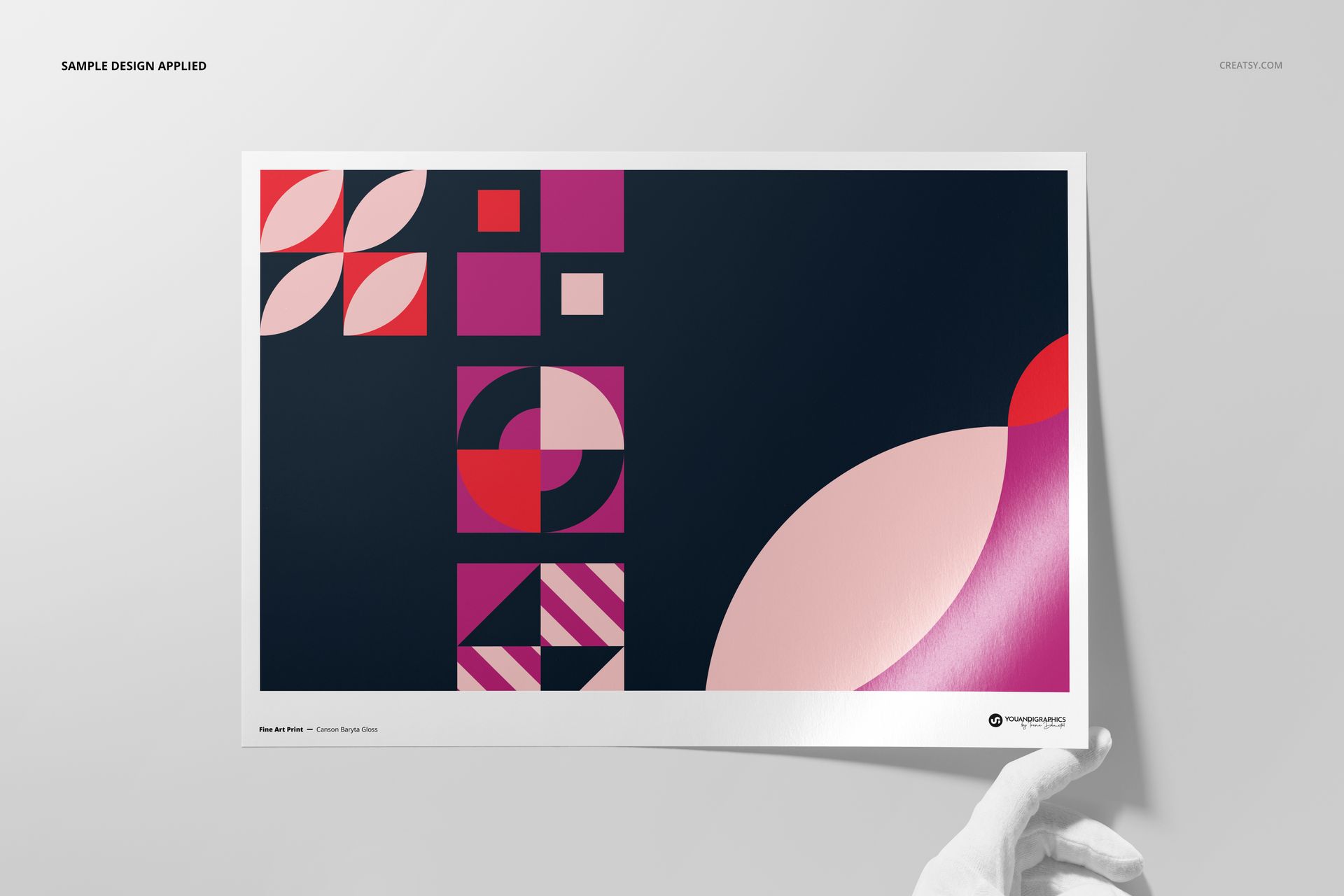 Top view of a rectangular art print mockup featuring bold geometric shapes in pink and navy, displayed with a white border.