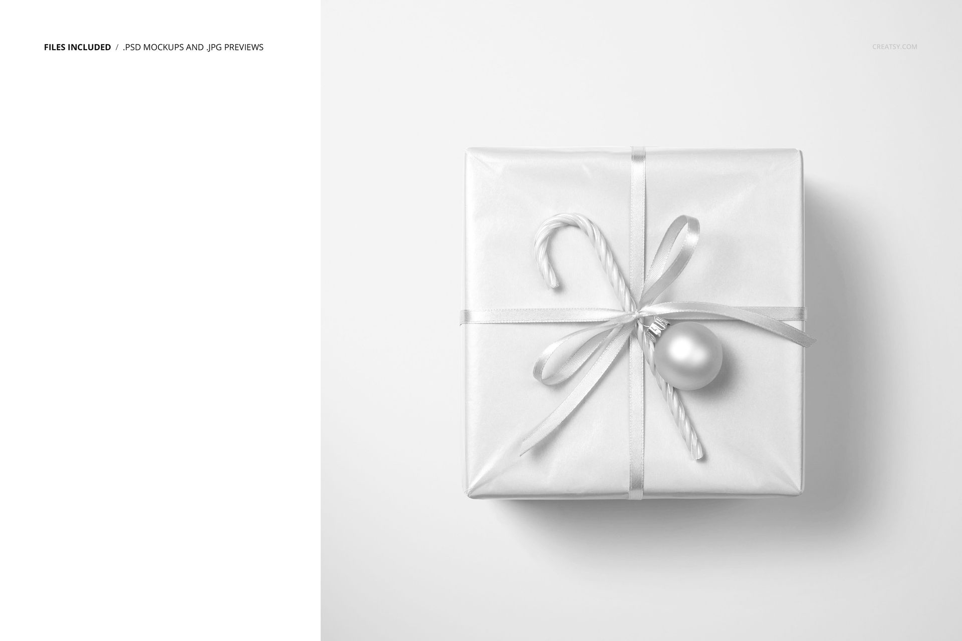 Christmas gift PSD mockup featuring a white-wrapped box, silver ribbon, candy cane, and metallic ornament, top view.