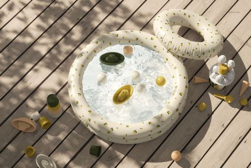 PSD mockup of a round inflatable kids' pool filled with water and toys, surrounded by summer props on a deck.
