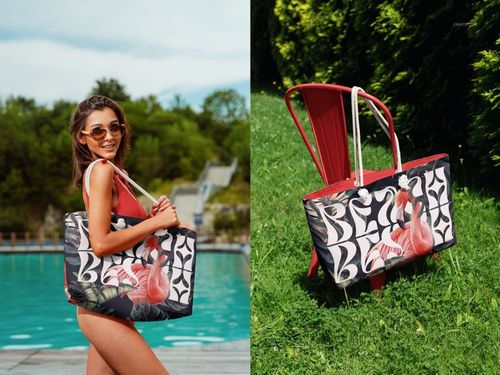 Spun polyester weekender bag mockup featuring bold tropical design, displayed by a pool and on a red outdoor chair.