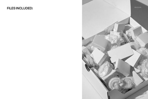 PSD mockup showing an open box with several hotel shower caps and small white boxes arranged inside.