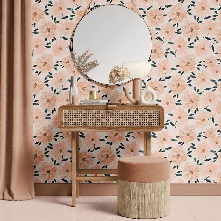 Dressing table mockup featuring a wooden vanity with a round mirror, floral wallpaper, and decorative vases on the tabletop.