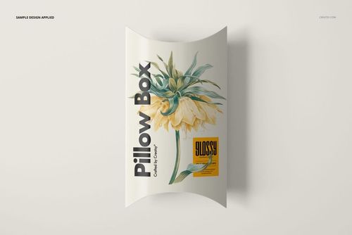 Top view of a rectangular pillow box mockup featuring a yellow flower design and bold black lettering.