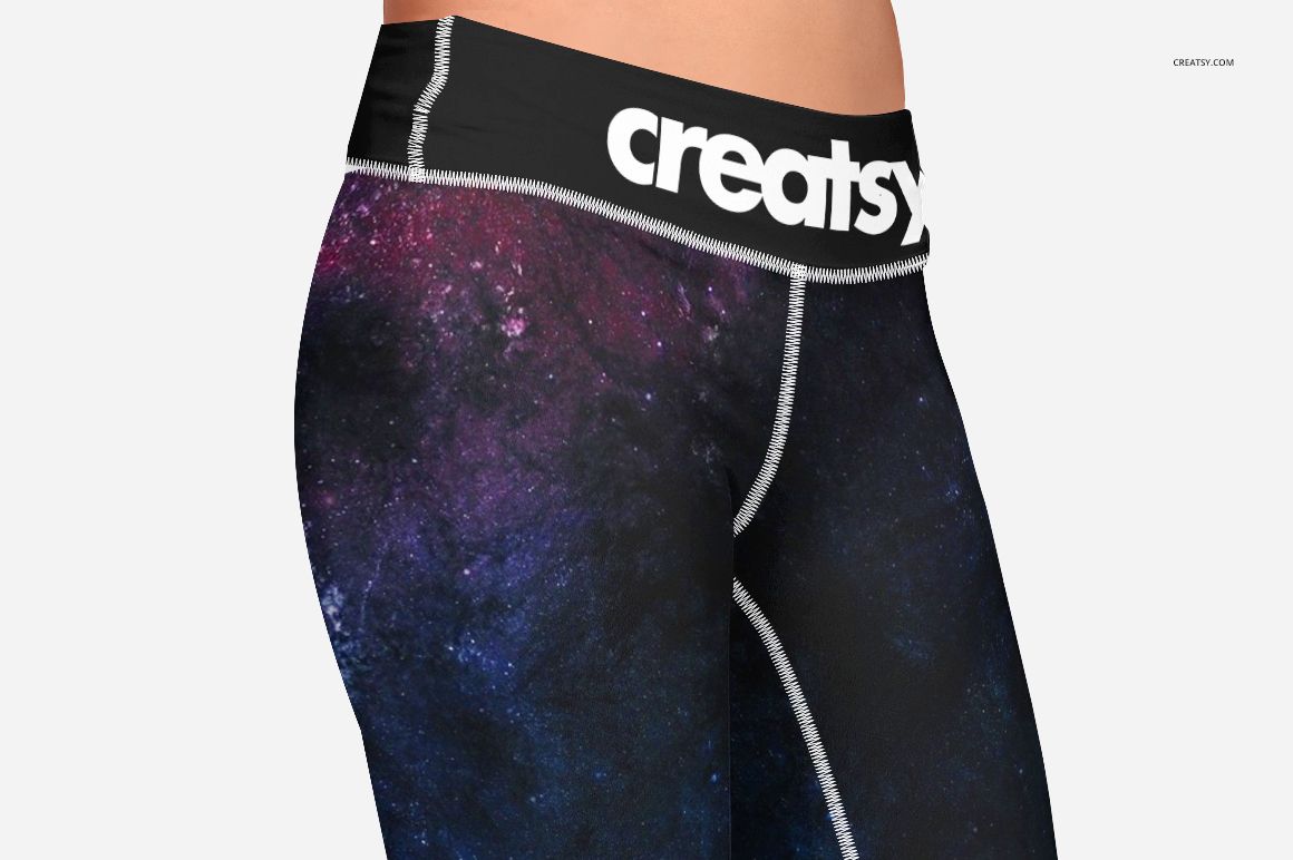 Front view of adult leggings mockup with a galaxy-inspired dark purple and blue pattern and black waistband on a white background.