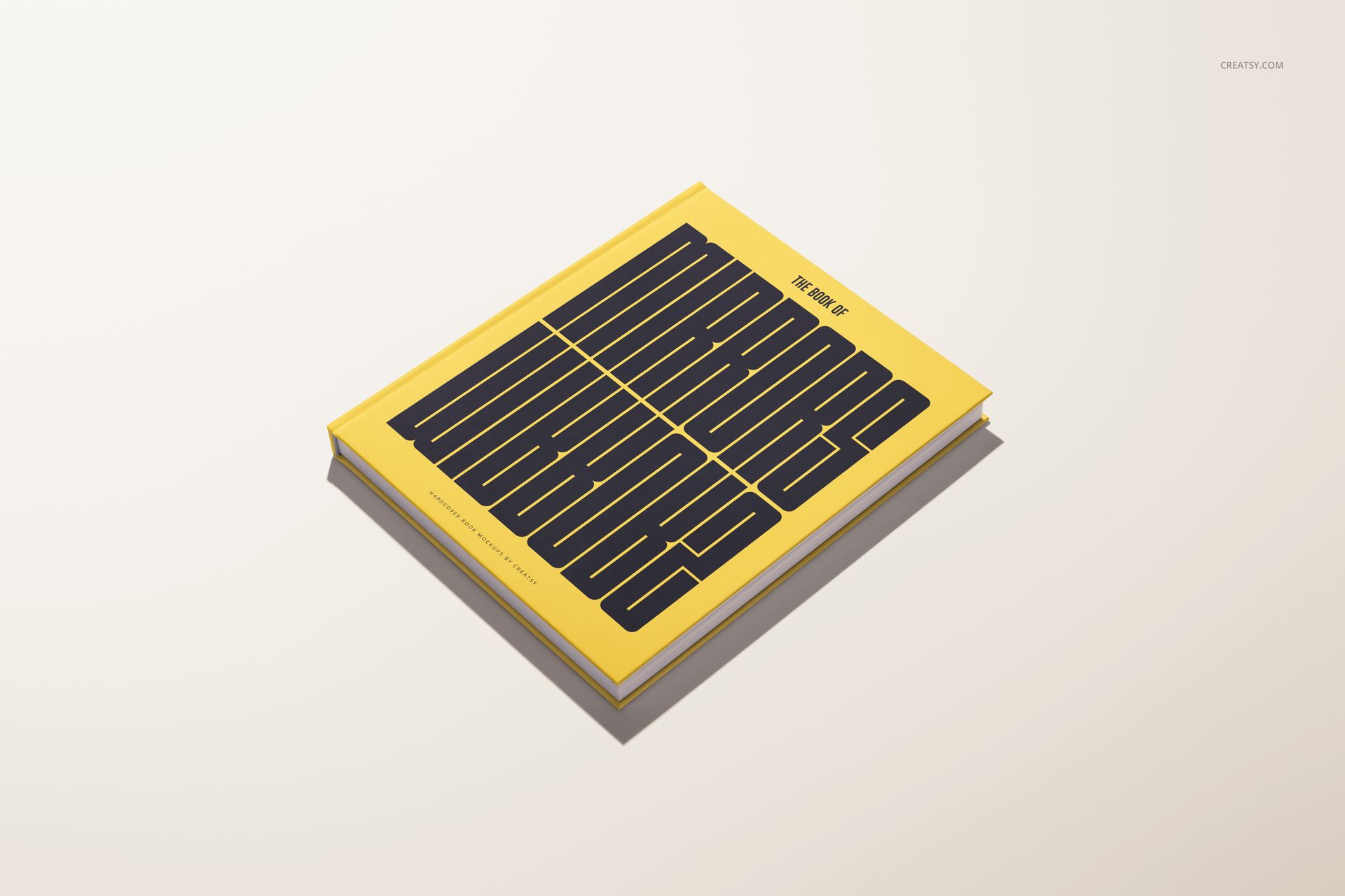 Yellow hardcover book mockup displayed at a slight angle, featuring large black lettering on the cover.