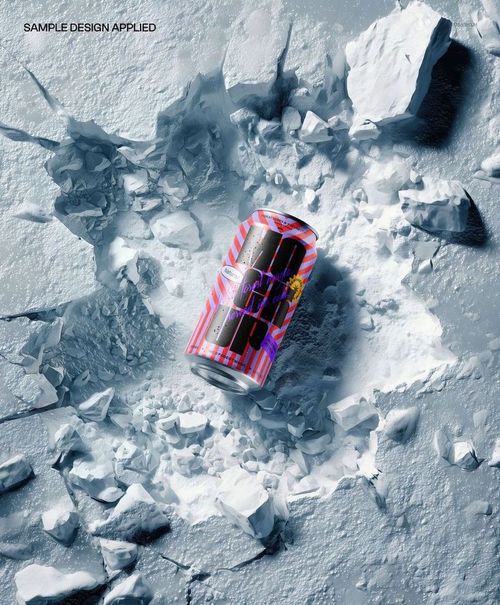 Top view of a colorful drink can mockup placed in a crater surrounded by cracked snow and ice textures.