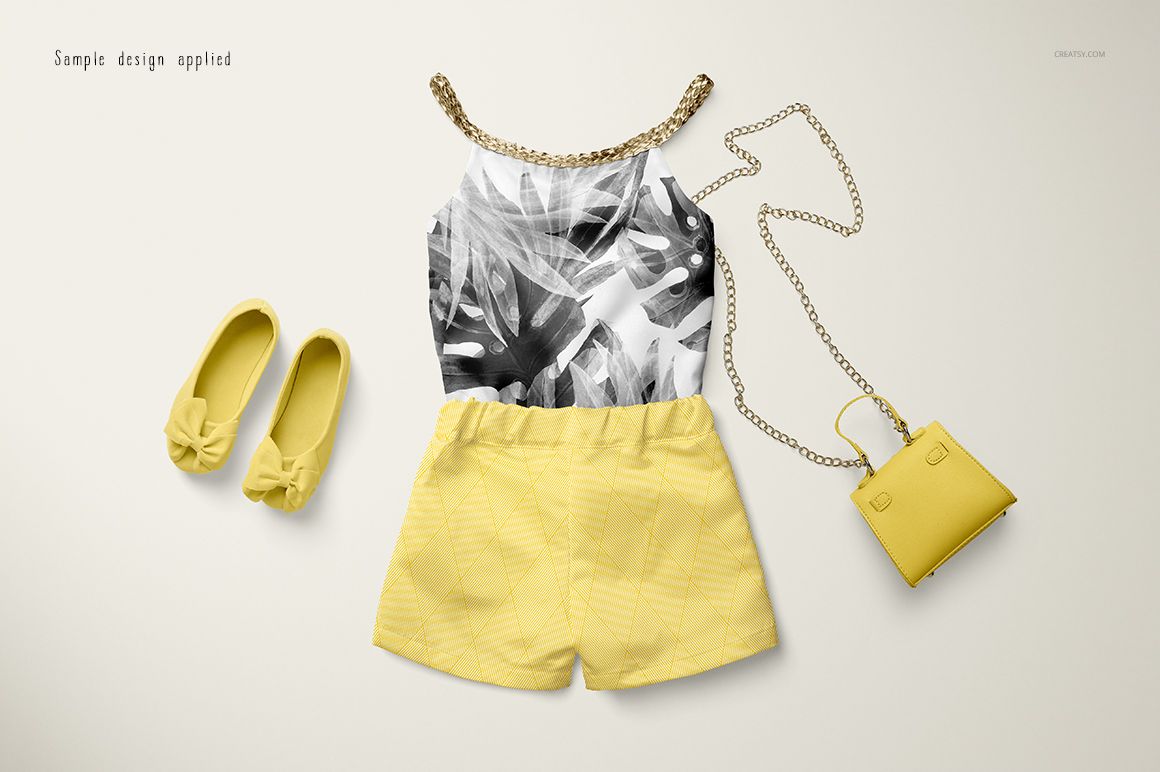 Baby summer set mockup featuring a sleeveless top with leaf pattern, yellow shorts, matching shoes, and a small purse on a light background.